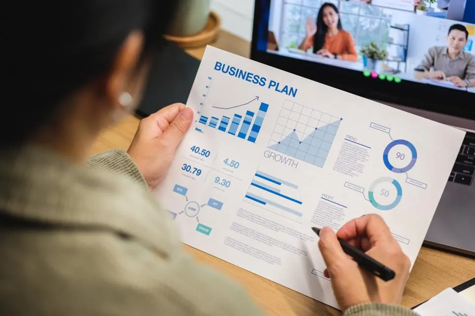 Reviewing a business plan during a video meeting