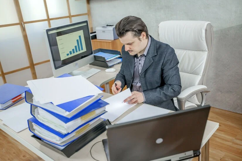 Reviewing business records and financial reports